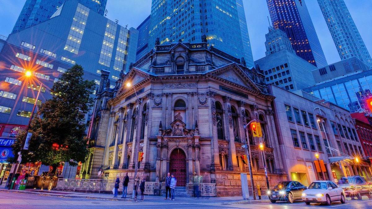 exterior view of the Hockey Hall of Fame in Toronto at night.